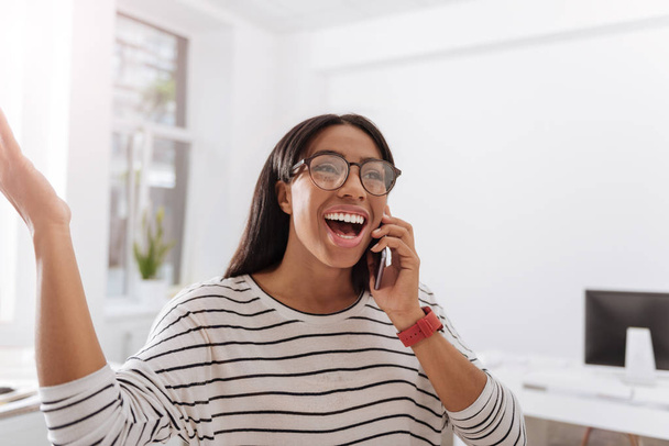 Happy joyful woman speaking on the phone - Valokuva, kuva