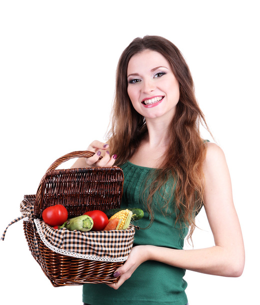 Beautiful woman with vegetables in wicker basket isolated on white - Photo, image