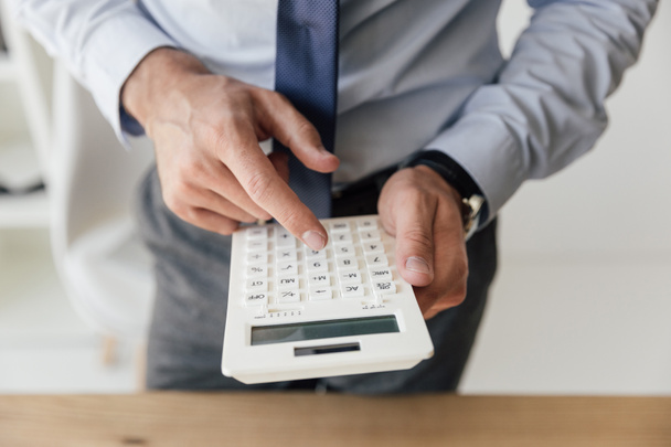 businessman using calculator - Photo, Image