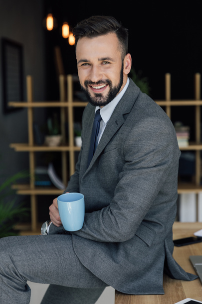 businessman with cup of coffee - Fotoğraf, Görsel
