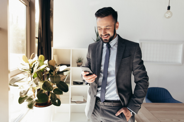 businessman using smartphone at office - Photo, Image