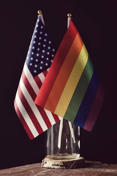 american and rainbow flags in a glass jar - Photo, Image