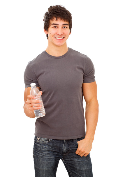mosolygó izmos sportos férfi vizes palack. - Fotó, kép