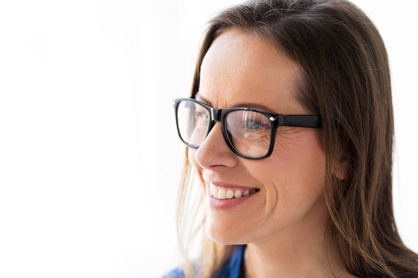 close up of smiling middle aged woman in glasses - Fotografie, Obrázek