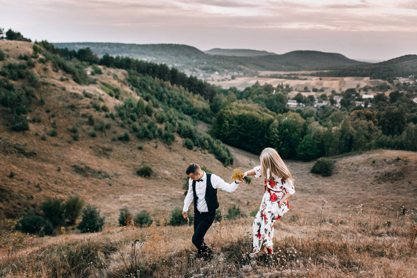 Loving couple on walk in mountain landscape - Foto, immagini