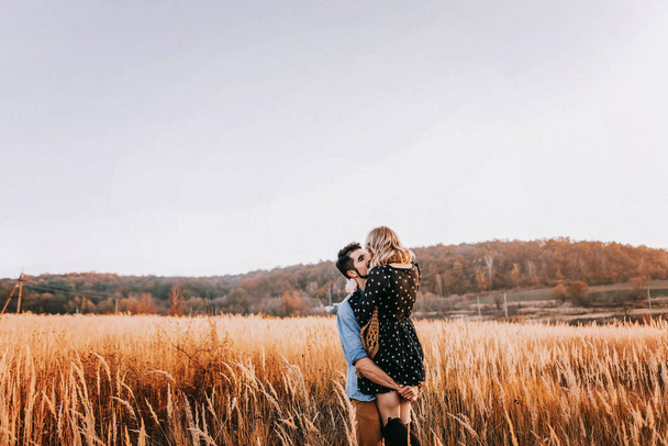 Couple embracing in wheat field - Fotó, kép