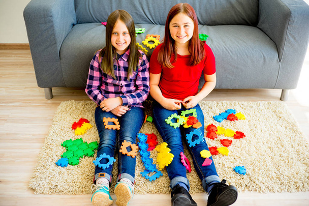 Two girls with colorful toys - Φωτογραφία, εικόνα
