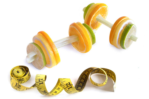 Food dumbbells and measuring tape  - Photo, Image