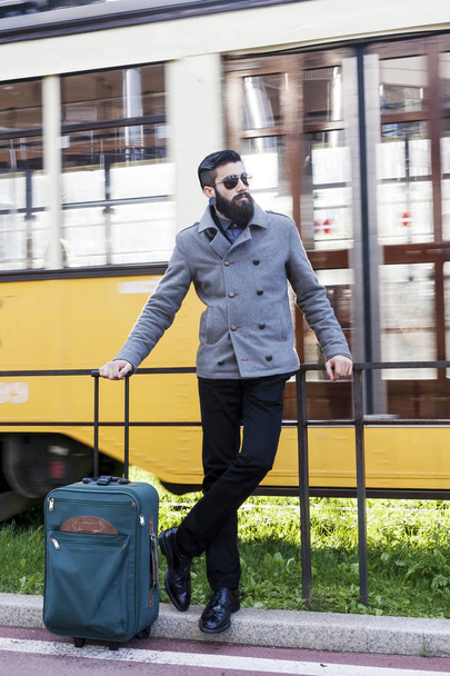 portrait of young hipsters businessman at the bus stop - Fotó, kép