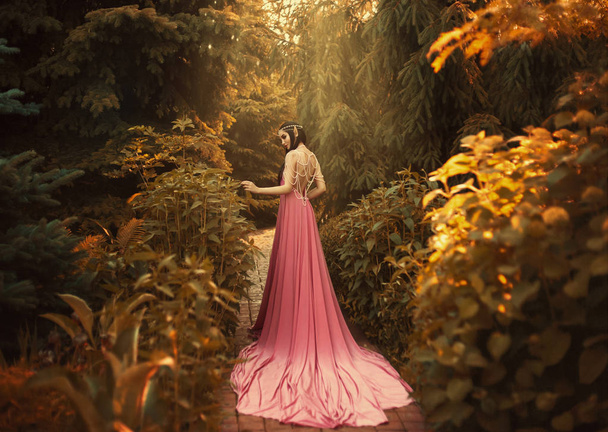 Fantasy girl in a fairy garden. - 写真・画像