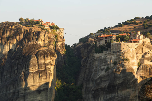 landscape of meteora in the morning with monastery on top of the mountain, Greece - Fotó, kép