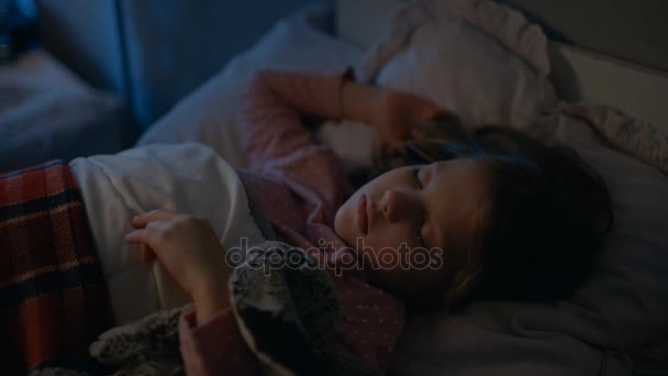 Sweet Little Girl Sleeps in Her Bed while Hugging Her Plush Toys. - Video, Çekim