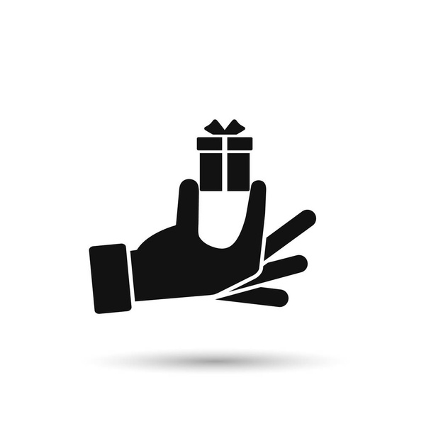 Icône de boîte cadeau tenant la main, illustration de silhouette isolée vectorielle
 - Vecteur, image