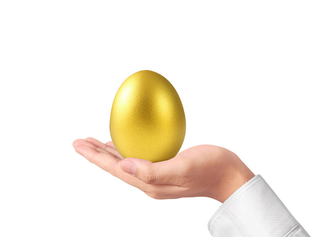 Χέρι εκμετάλλευση από χρυσά αυγά - Φωτογραφία, εικόνα