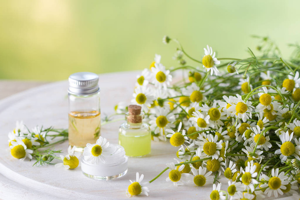 Body care cosmetic products with camomile and camomile flowers - Fotoğraf, Görsel
