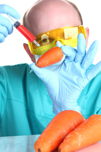 Scientist injecting GMO into the carrot - Fotó, kép