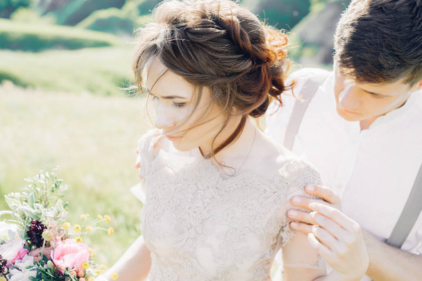 wedding couple on  nature.  bride and groom hugging at  wedding. - 写真・画像