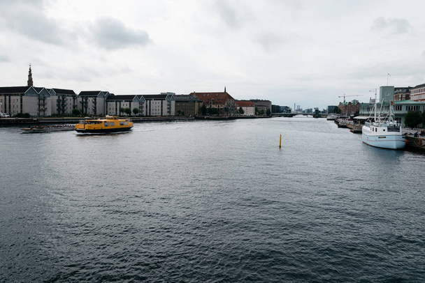  Waterfront of Copenhagen with nautical vessel on the water a cl - Photo, Image