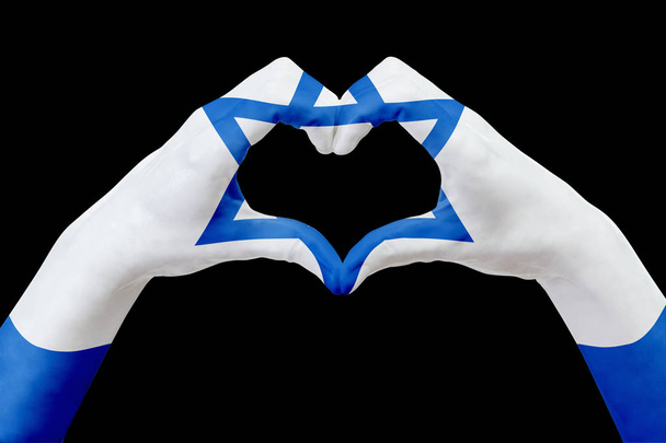 Hands flag of Israel, shape a heart. Concept of country symbol, isolated on black. - Фото, зображення