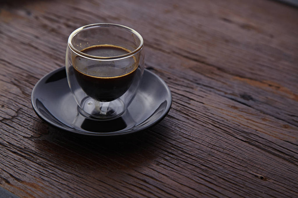 cup of hot espresso coffee shot on wooden table - Foto, Imagem