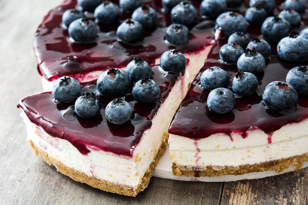 Blueberry cheesecake on wooden table - Photo, Image