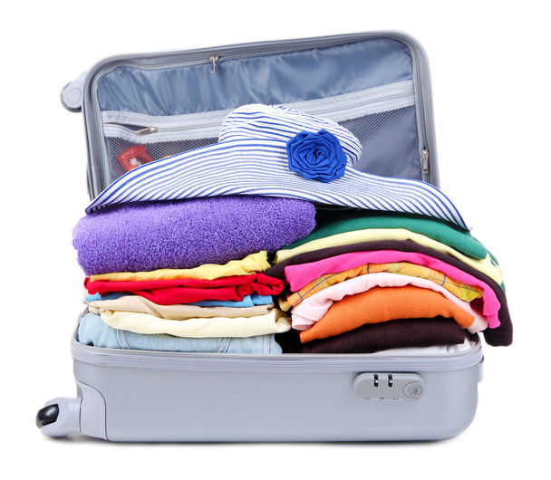 Open silver suitcase with clothing isolated on white - Φωτογραφία, εικόνα