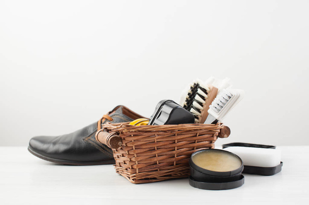 Care shoes and mens black shoes on white  - Fotografie, Obrázek