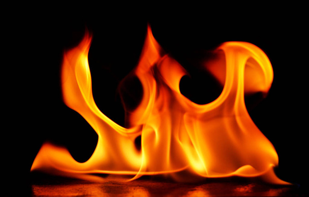 Beautiful fire flames on black background. - Photo, Image