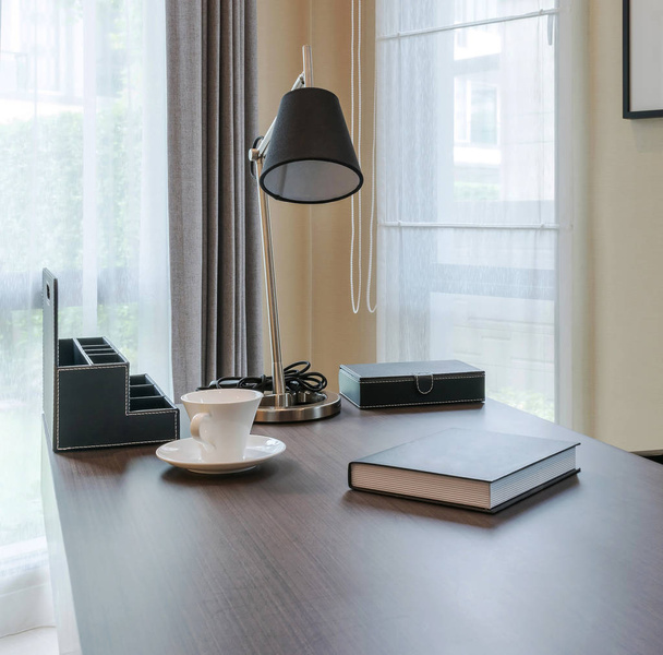 wooden table and books in modern working room interior - Foto, Bild