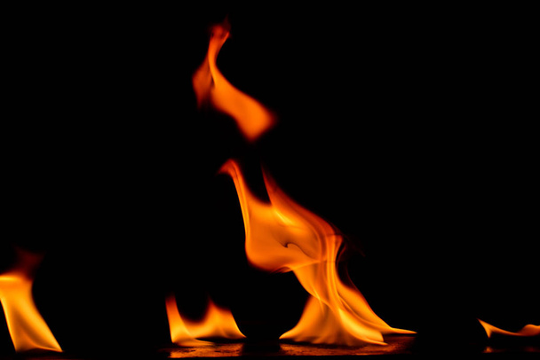 Beautiful fire flames on black background. - Zdjęcie, obraz