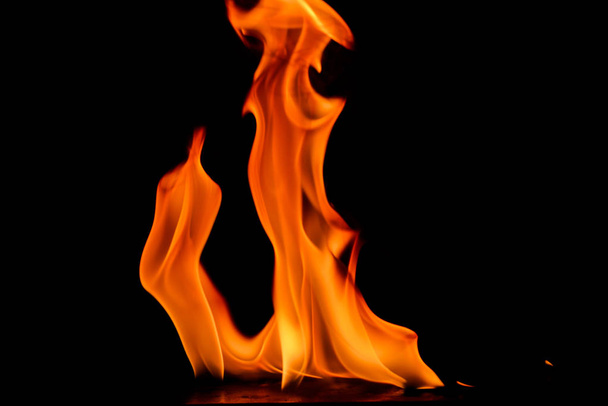 Beautiful fire flames on black background. - Valokuva, kuva