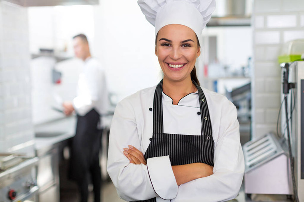 Female chef in kitchen - Valokuva, kuva