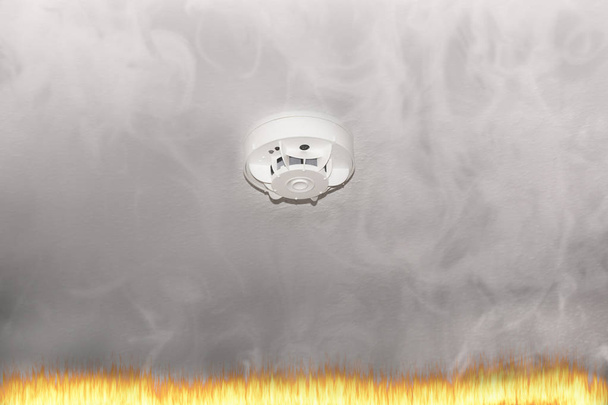 Smoke detector on the ceiling and smoke.  - Photo, Image
