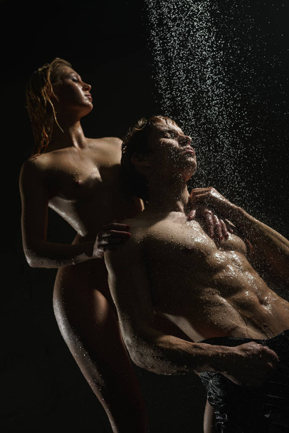 Passionate couple having sex in shower studio shot - Foto, Imagen
