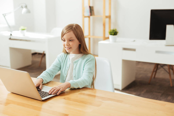 Focused diligent girl working with her laptop - Fotografie, Obrázek