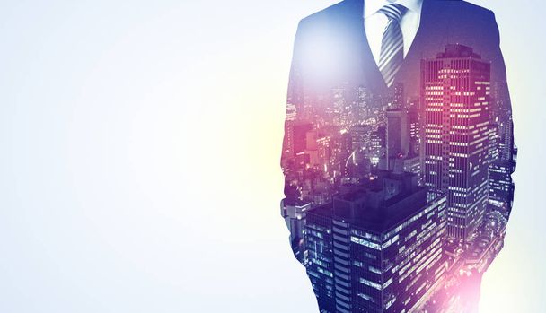 Businessman standing with night city graphic - Foto, Imagem