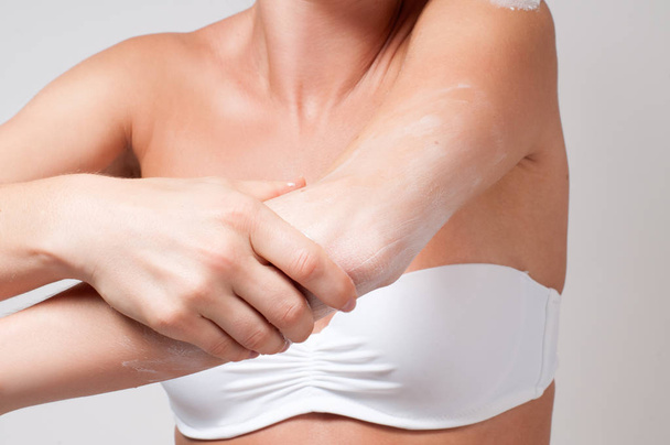 Beauty and Body care. Woman applying cream on her elbow.  - Φωτογραφία, εικόνα