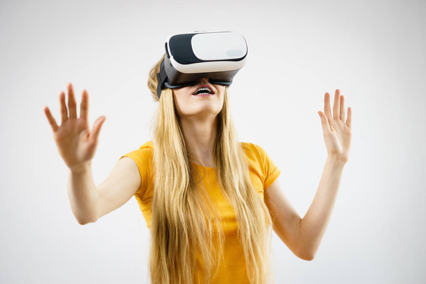 Girl wearing virtual reality goggles. - Fotó, kép