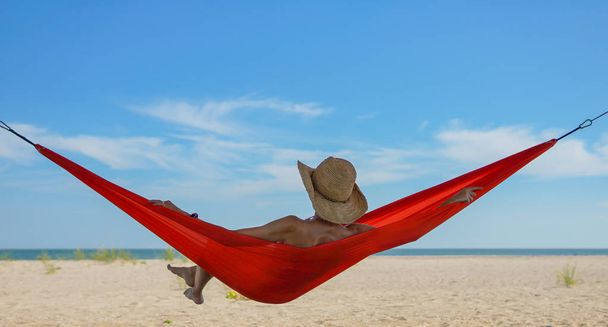 Relaxed woman lying in a hammock - Photo, Image