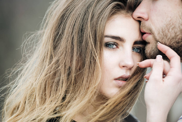 Sensual male lips touching cute face of beautiful woman - Fotografie, Obrázek