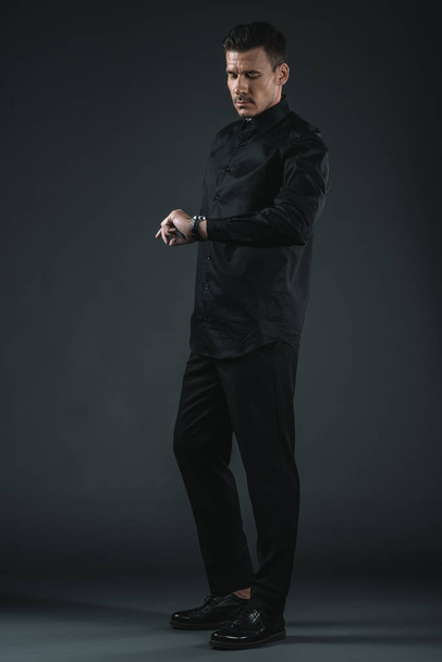 fashionable man in black outfit - Фото, зображення