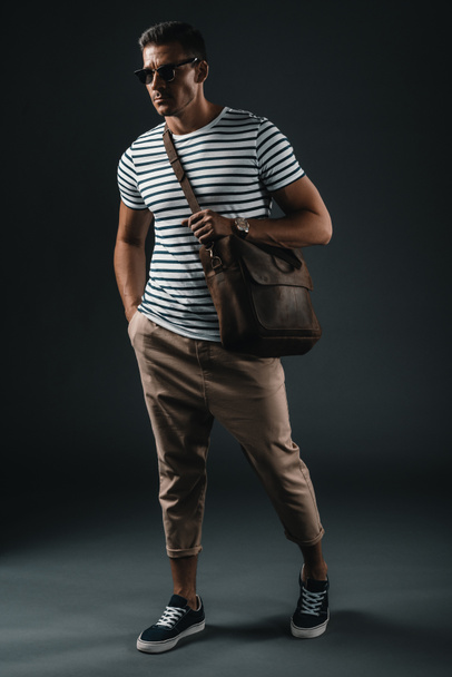 Stylish man with leather bag  - Fotoğraf, Görsel