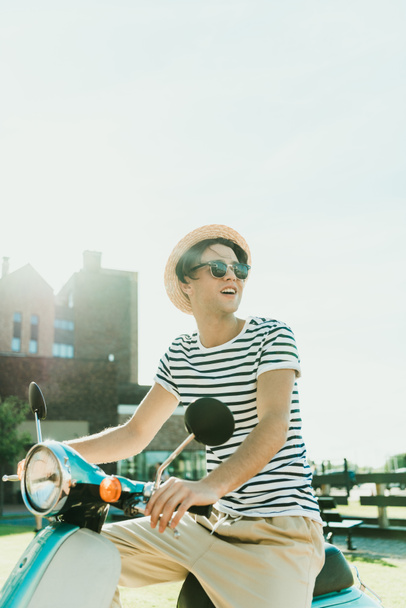 man riding scooter - Valokuva, kuva
