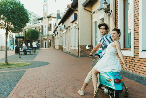 couple sitting on scooter - Photo, Image