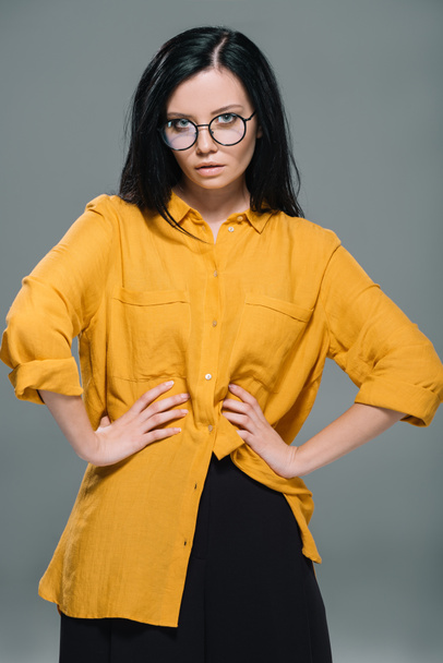 brunette woman in yellow blouse - Foto, imagen