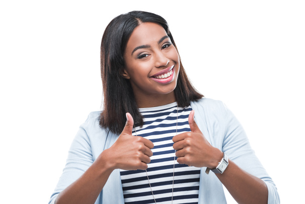 Young woman gesturing thumbs up - Foto, Imagem