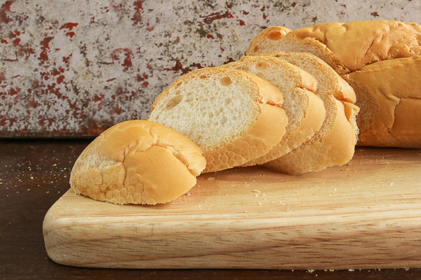 fresh bread slide on wooden cutting board - Photo, Image