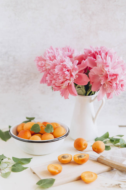 Whole and cut fresh apricots - Фото, изображение