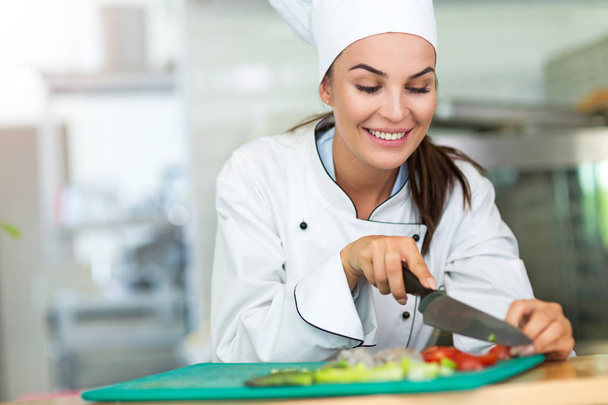 Female chef in kitchen - Photo, image