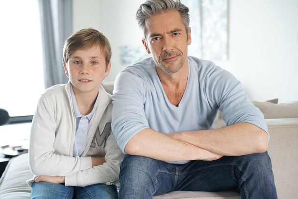  father and son relaxing in sofa - Photo, image